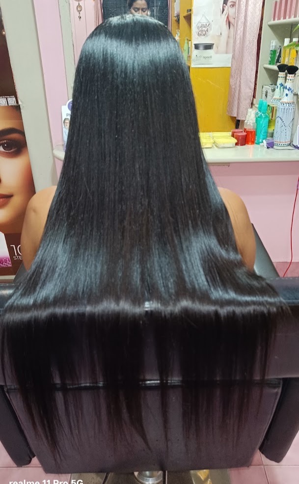Long black hair over a salon chair