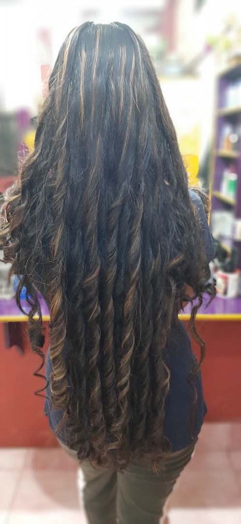 Long dark curls with brown highlights